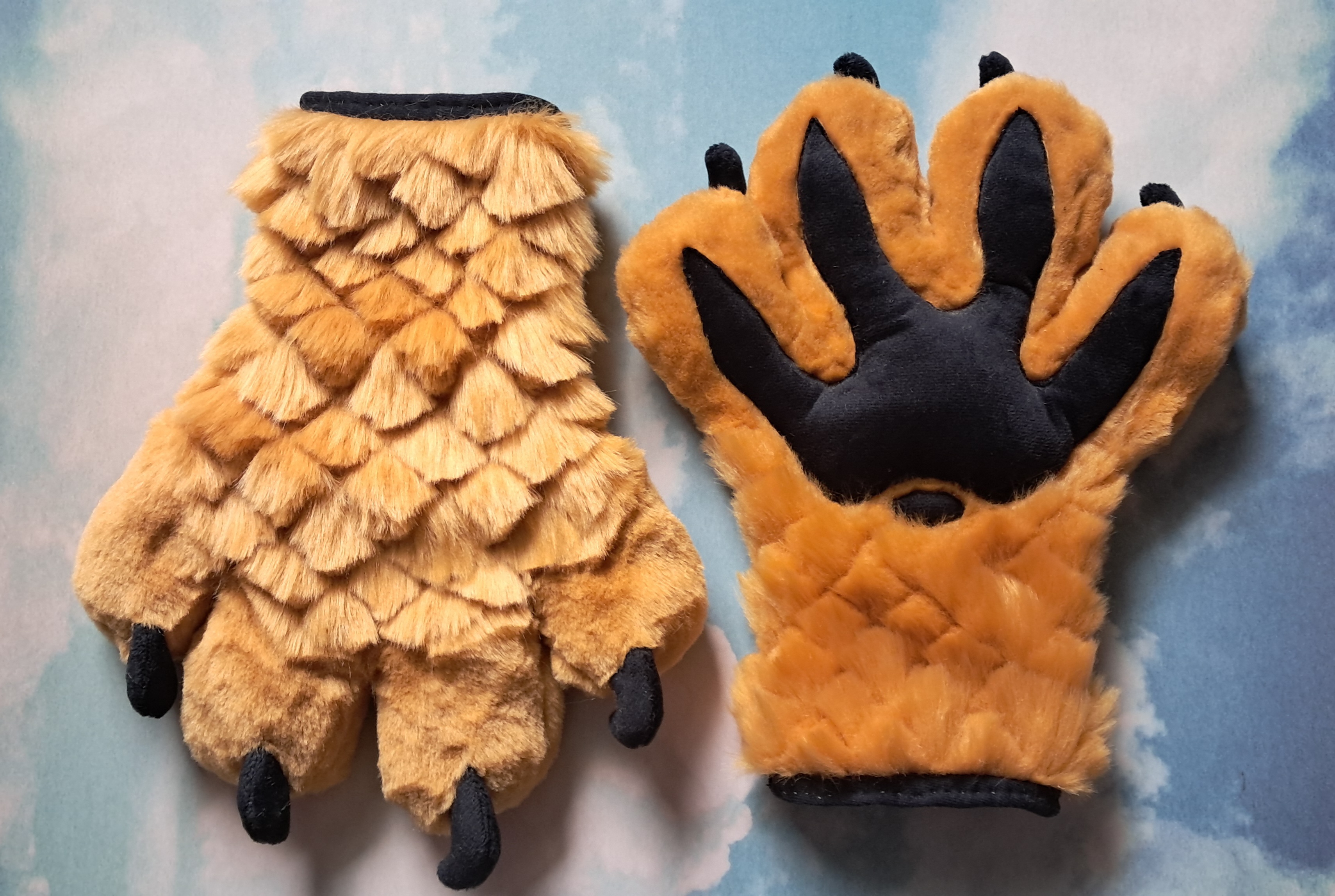 Golden, scaled handpaws