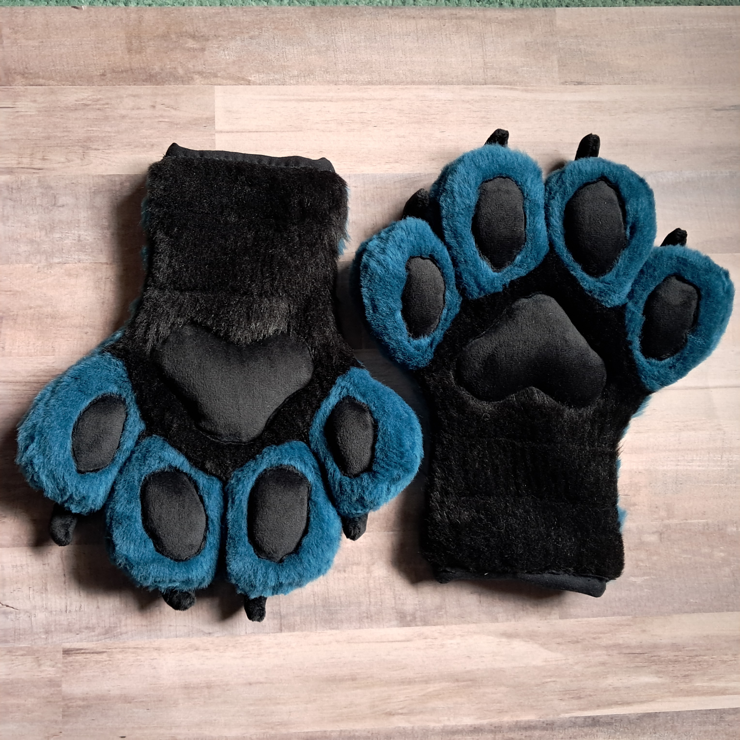 Scaled blue/teal handpaws