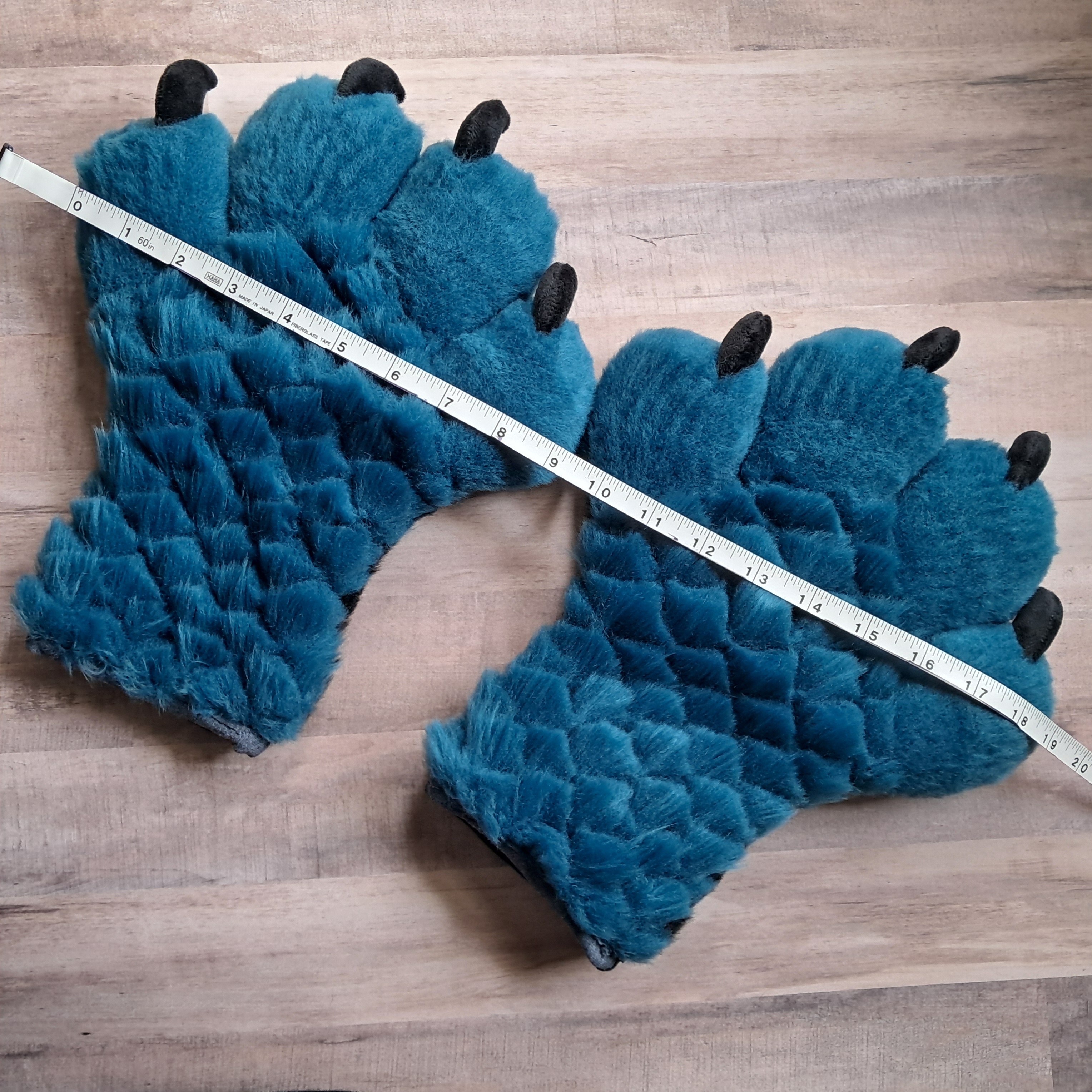 Scaled blue/teal handpaws
